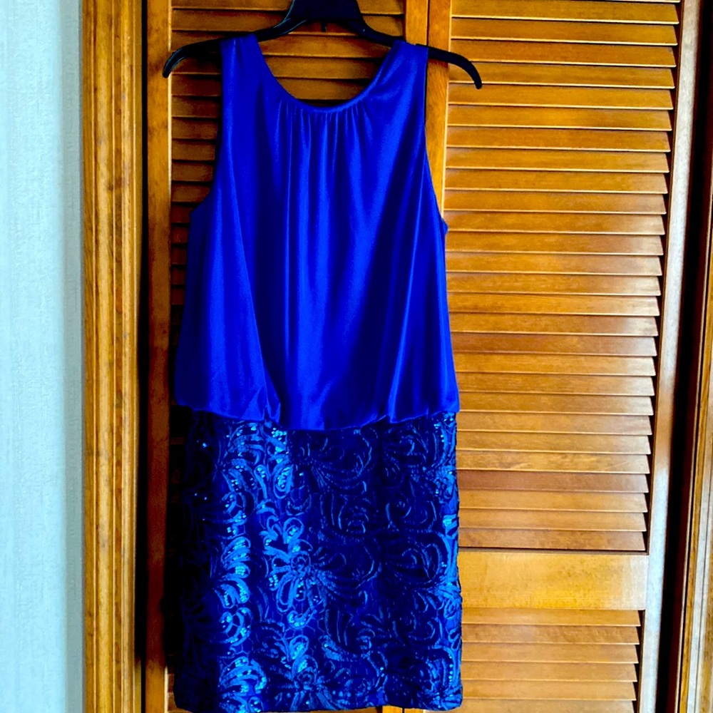 Dress blue color with beautiful design in the bottom size.